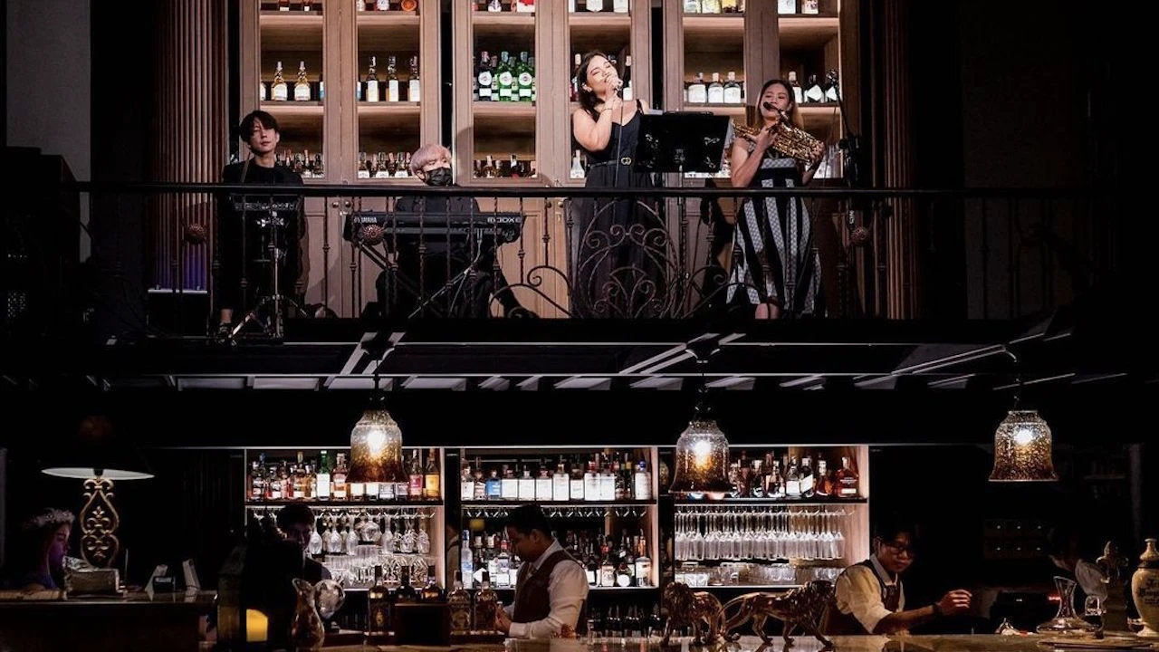 a female singer is singing during a jazz concert at abandoned mansion bar in Bangkok