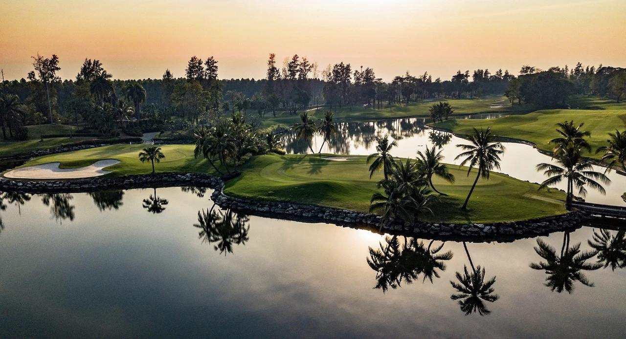 big lake and trees at alpine golf sports club near bangkok
