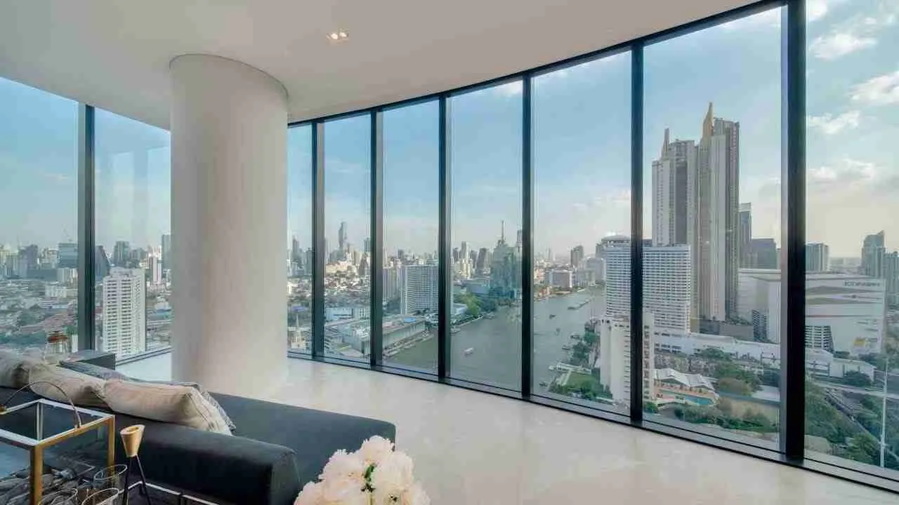 living room with view over the Chao Phraya at the Banyan Tree Residences in Bangkok