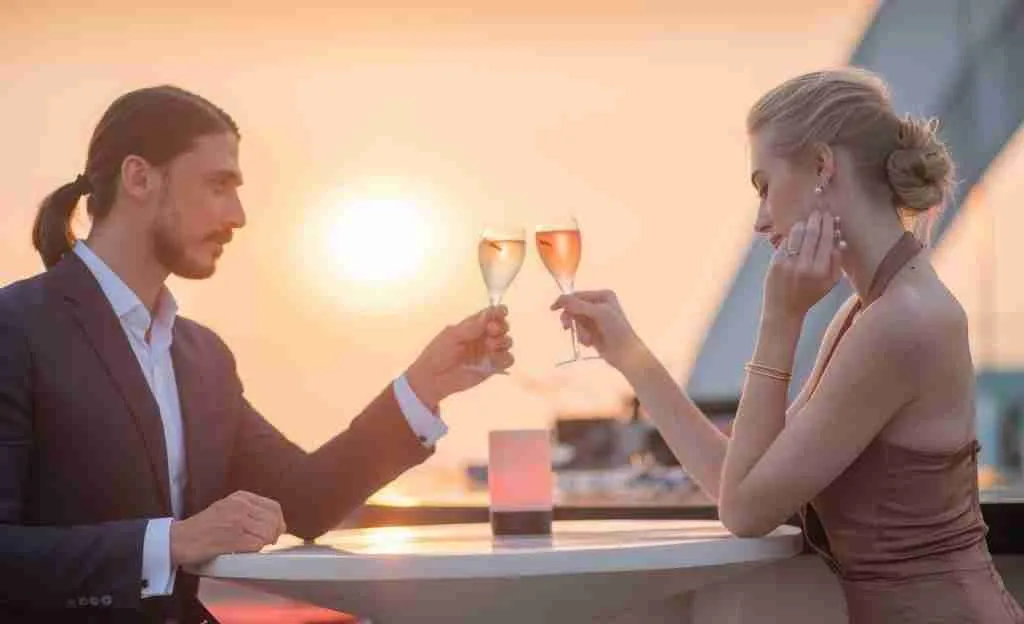 beautiful couple drinking champagne at Cru Champagne bar in Bangkok