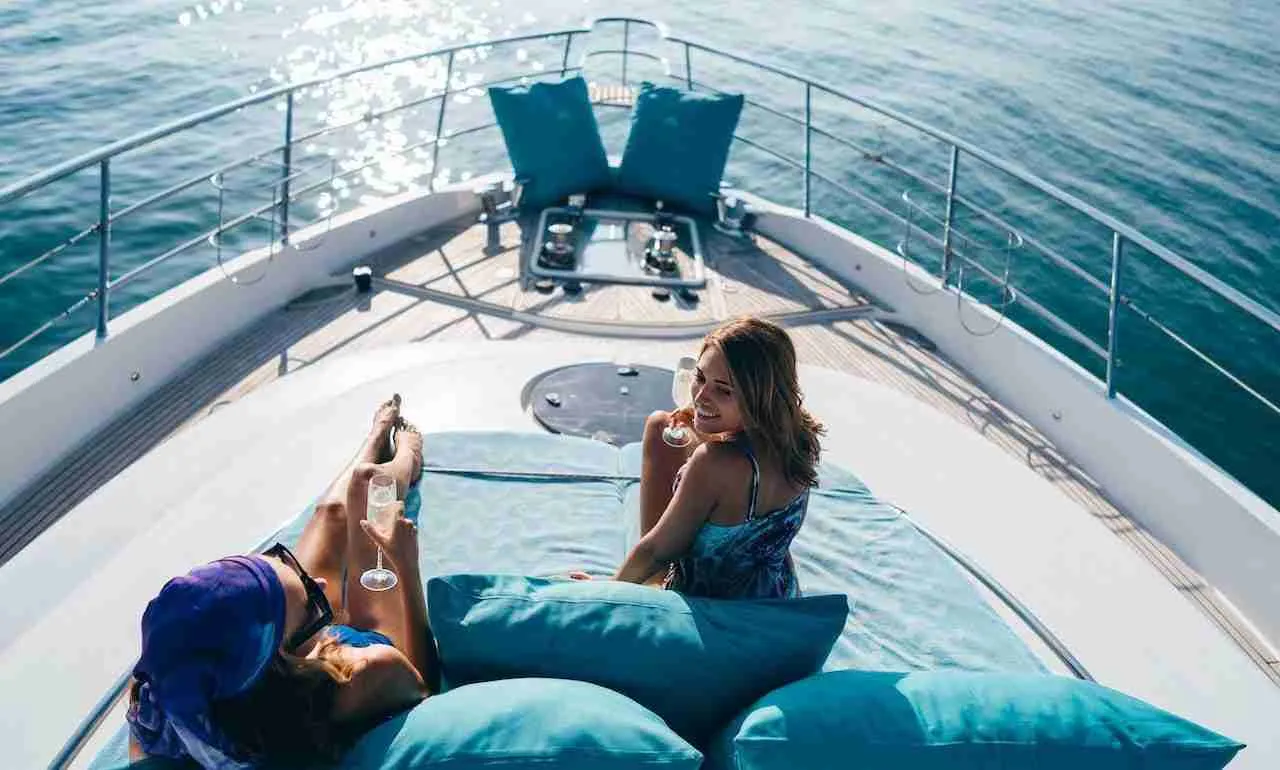 couple drinking Champagne on the deck of a luxury yacht in Phuket