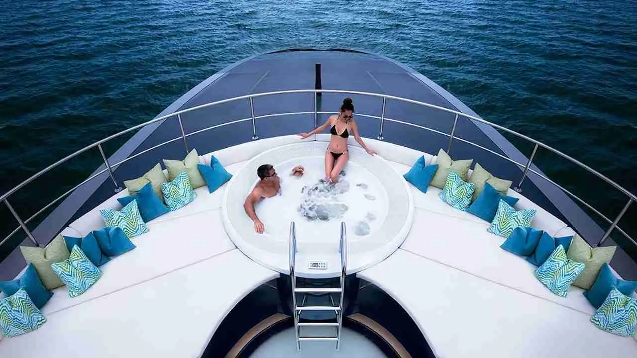 couple in a hot tub on top of a luxury yacht in Thailand