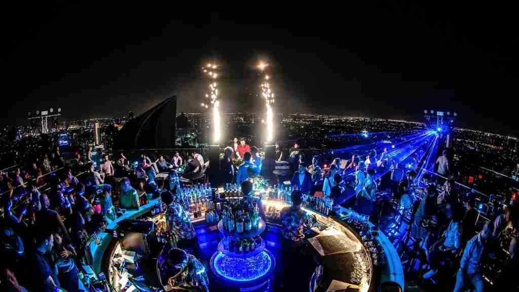 flares and lights during a VIP party at a rooftop bar in Bangkok