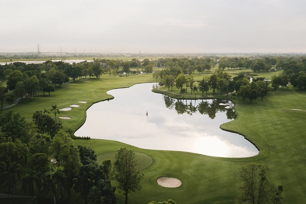 a large lake in golf course at flora ville golf country club