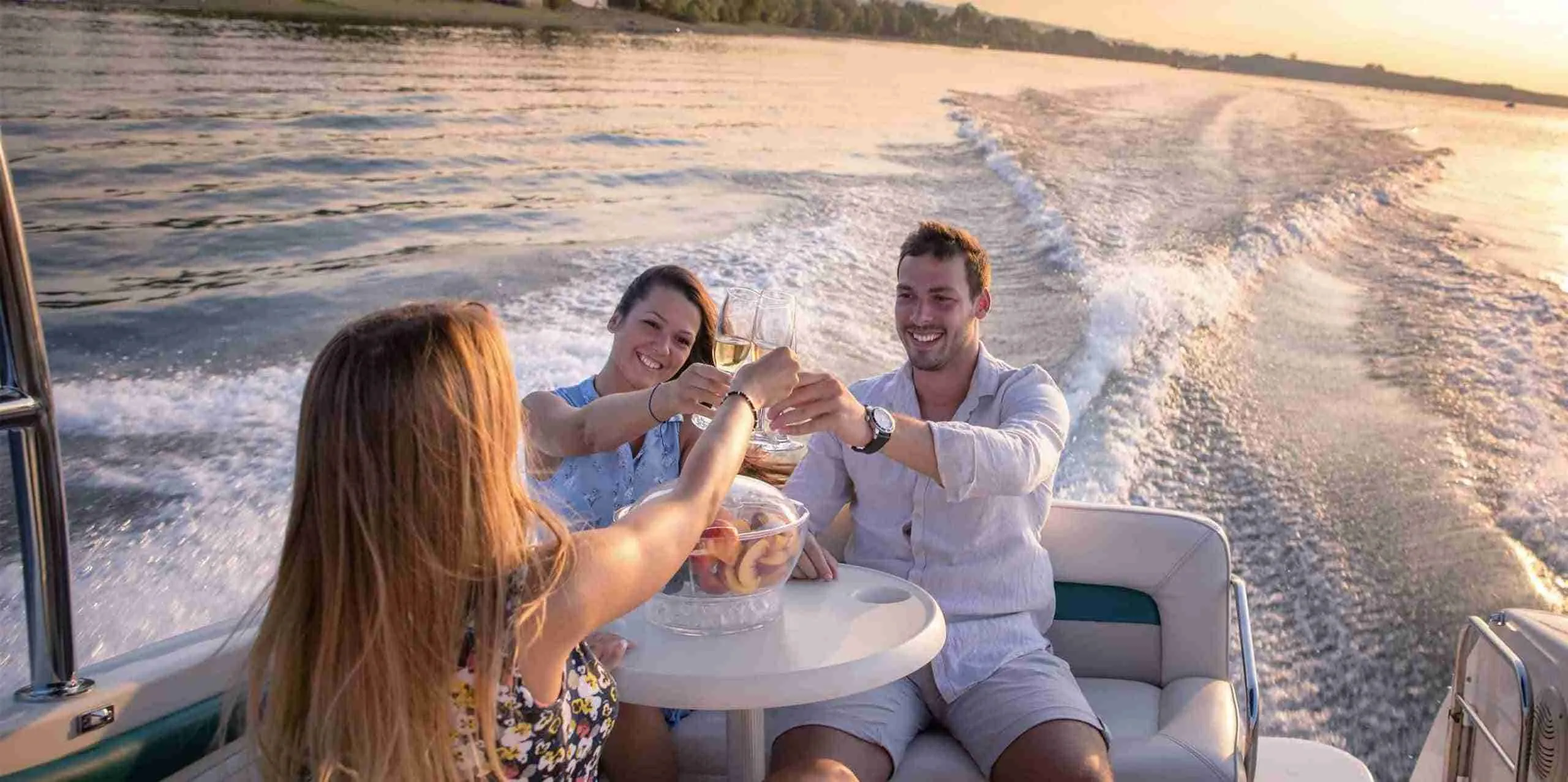 friends drinking at a boat party in Pattaya during the sunset