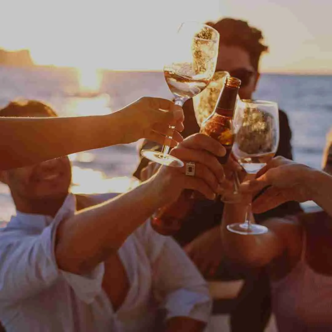 friends drinking during a sunset cruise in Thailand