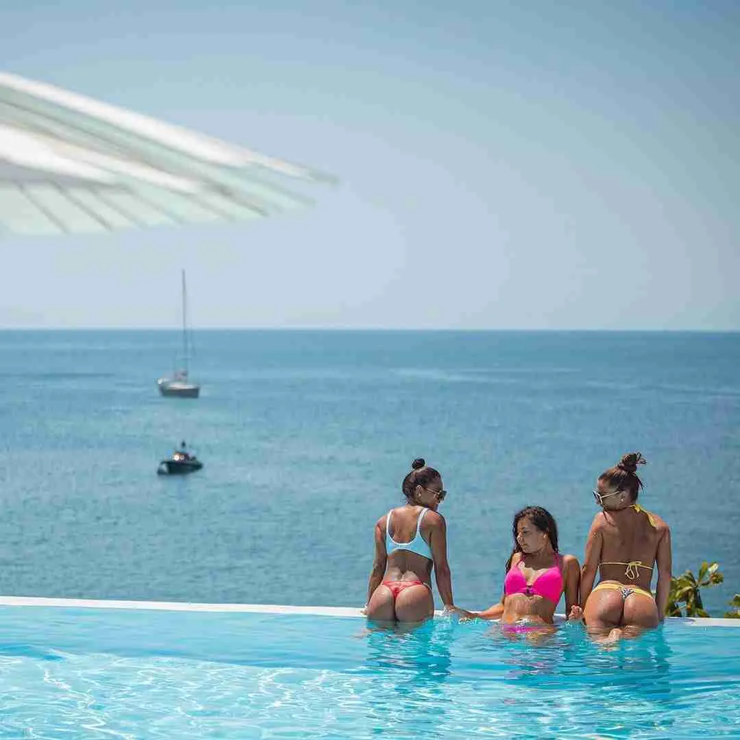 girls in bikini in a infinite pool in Thailand