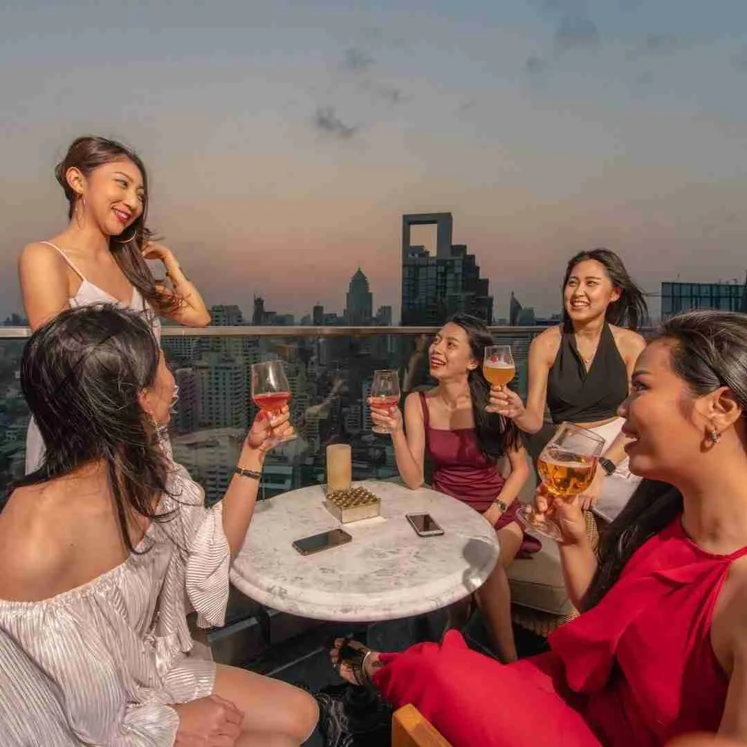 girls drinking at a rooftop bar in Bangkok Thailand