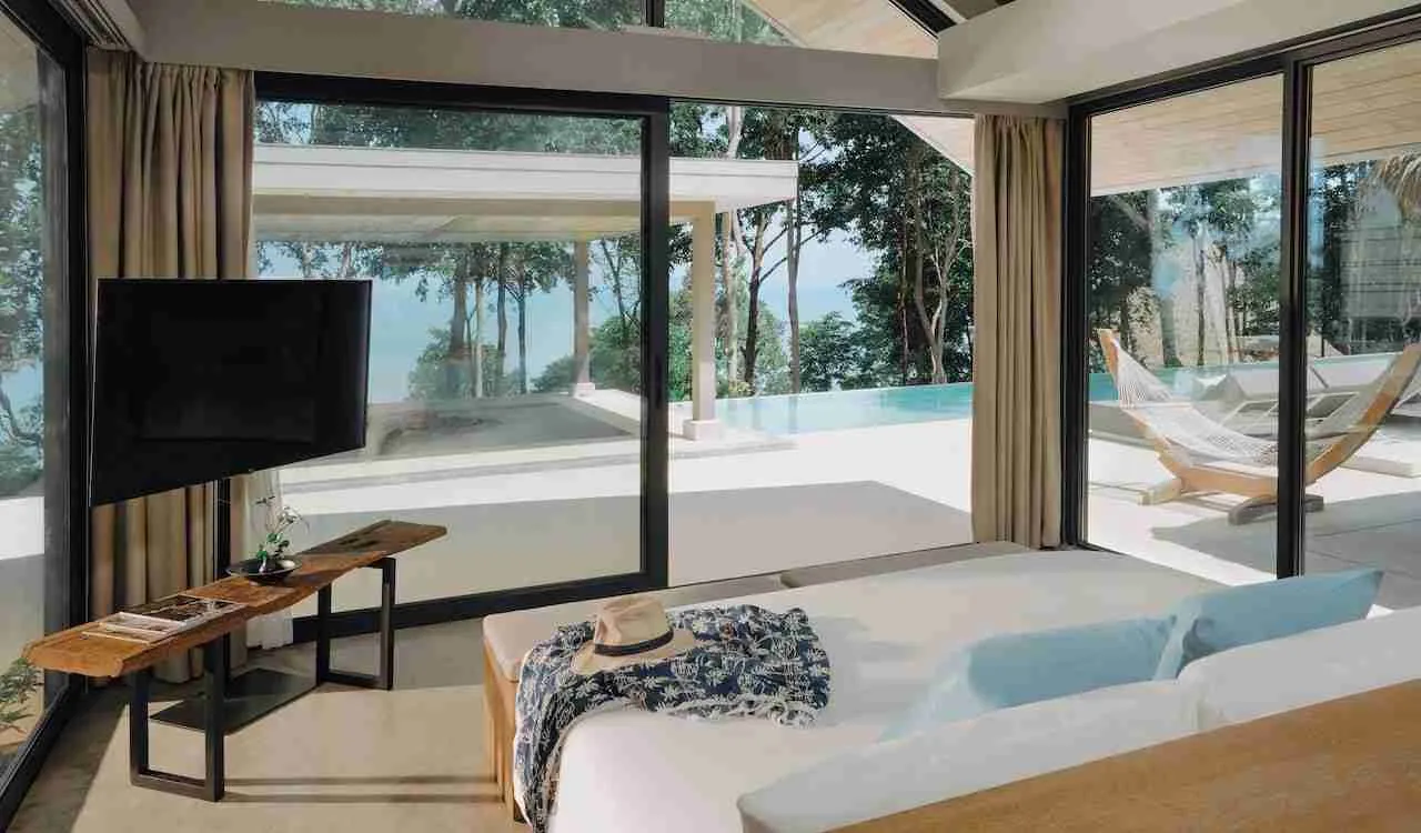bedroom with swimming pool view at Island escape resort by Burasari Phuket in Thailand