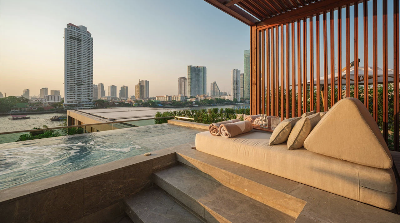 jacuzzi and view on bangkok in verandha room at capella bangkok