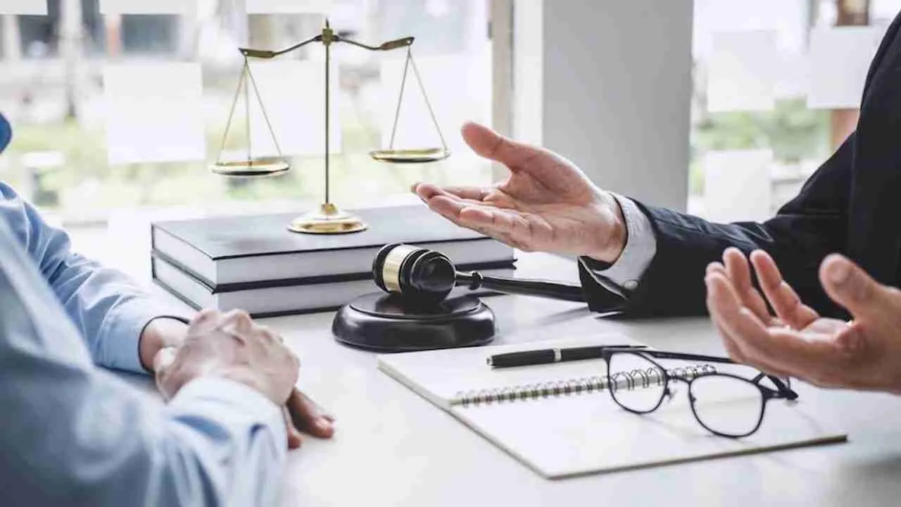 lawyer talking to a client with his hands open