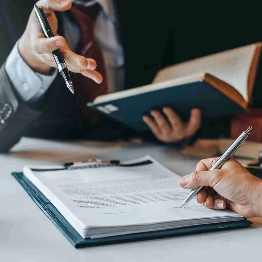 a lawyer and his client going over legal papers in Thailand