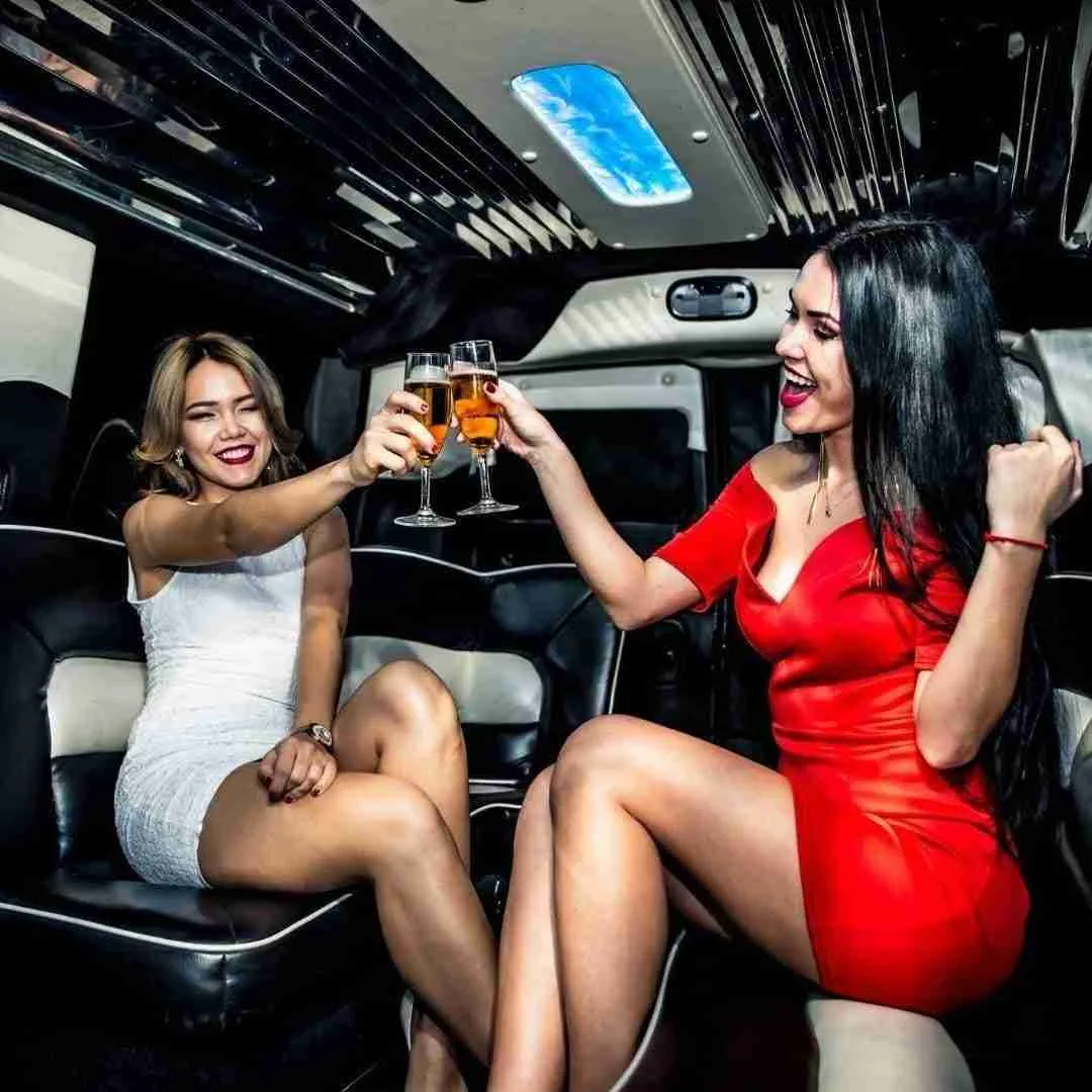 sexy women partying and drinking in a limousine in Bangkok