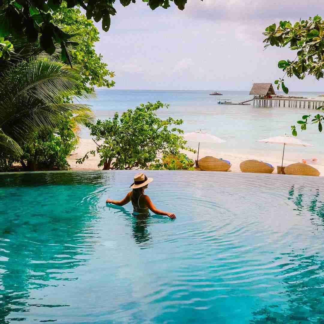 women in a pool at a luxury hotel in Thailand