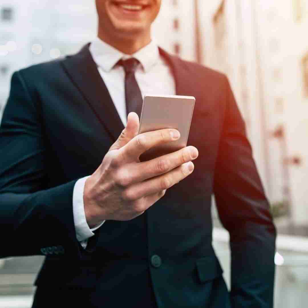 man booking a concierge service on his smartphone