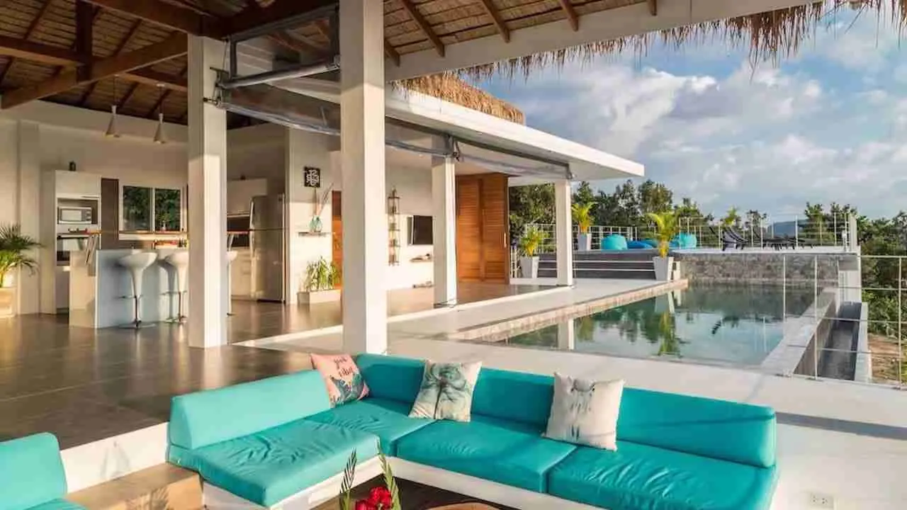 open living room and infinity pool of a luxury villa in Pattaya