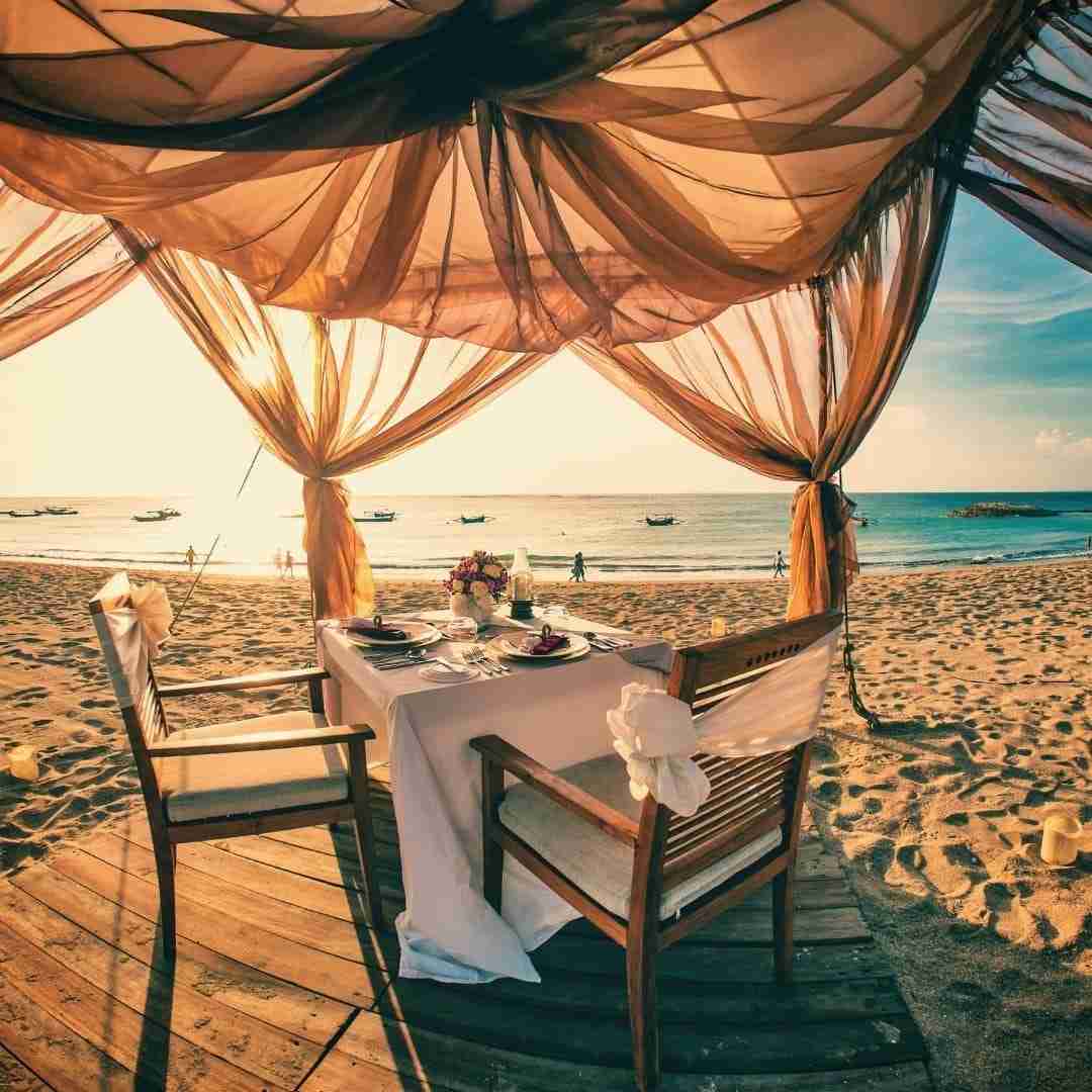 private beach dinner in Thailand during the sunset