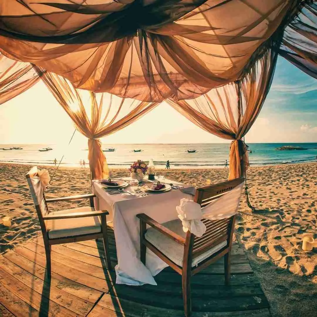 private beach dinner in Thailand during the sunset