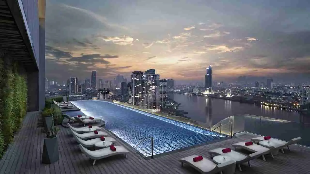 swimming pool and view over Bangkok from a serviced apartment building