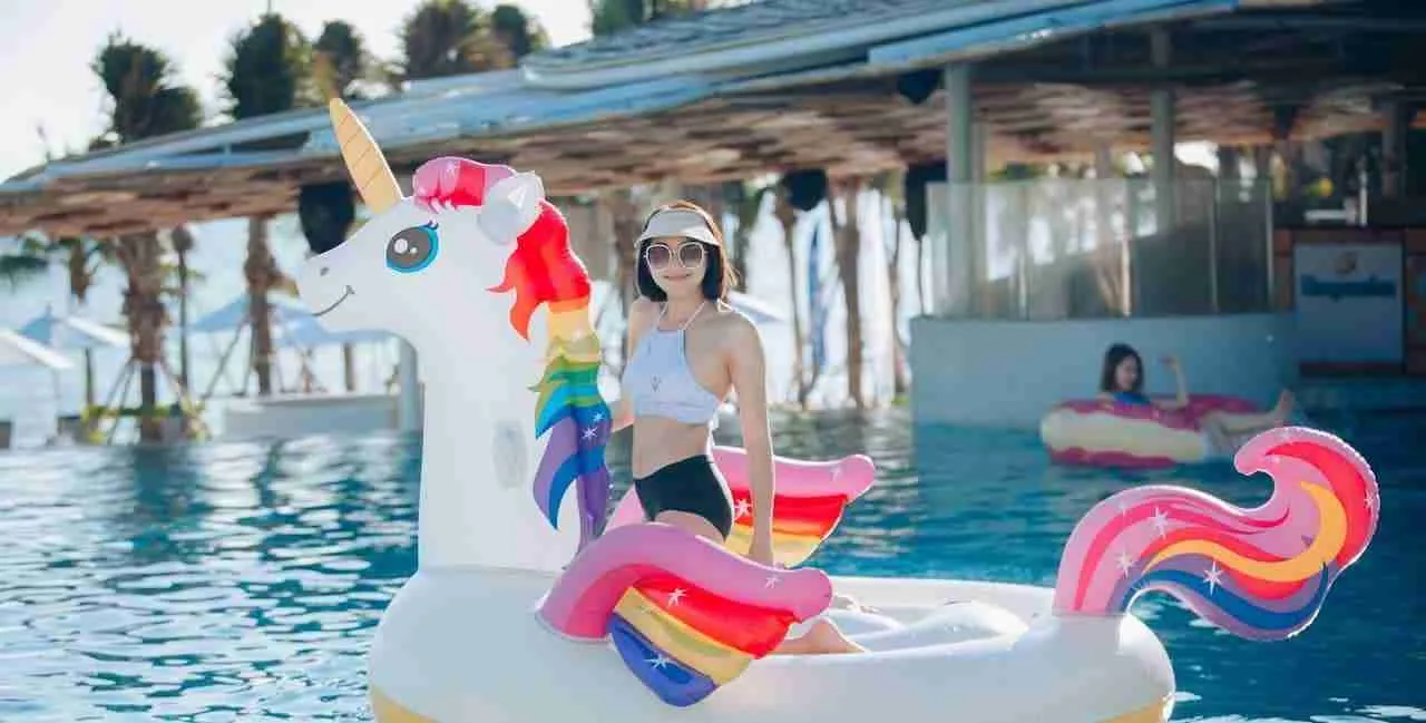 thai girl on a floatable at a beach club in Pattaya