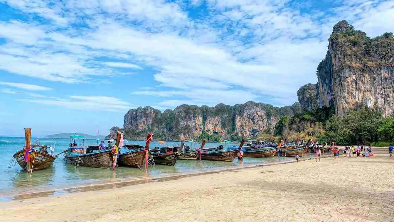 railay beach with longtail boats in Krabi Thailand