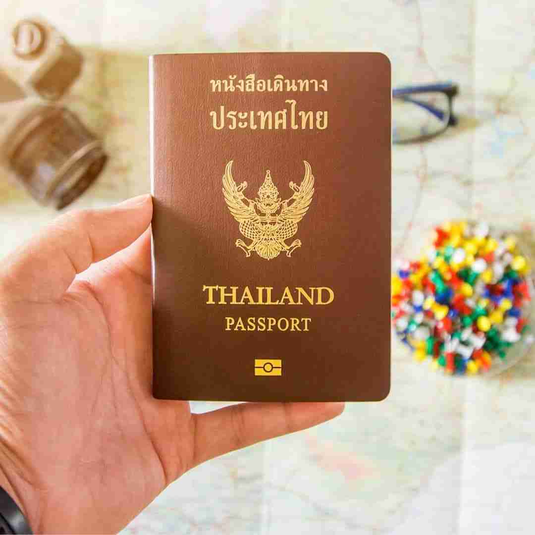 thai passport over a map