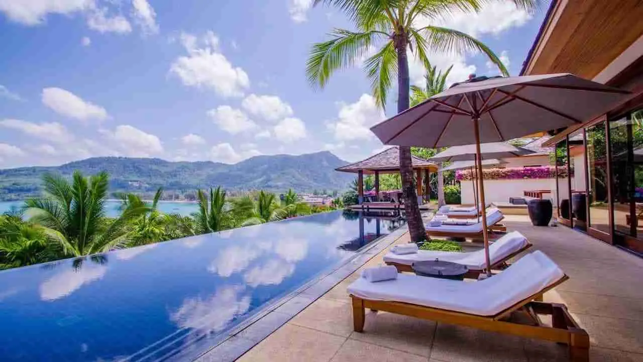 luxury pool villa in Phuket Thailand with infinite pool sunbeds and sea view