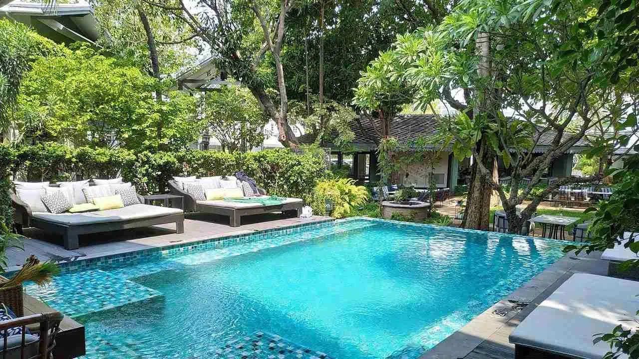 outdoor pool and garden of The Raweekanlaya pool villa in Bangkok