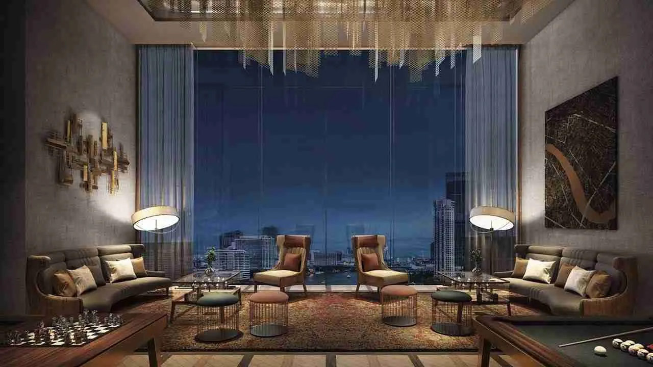 living room with city view at night at The Residence Mandarin Oriental luxury condominium in Bangkok