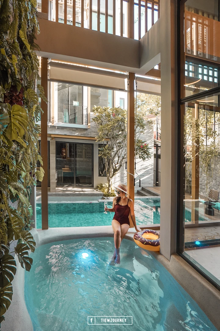 A woman sitting in the private jacuzzi at shan villas sukhumvit