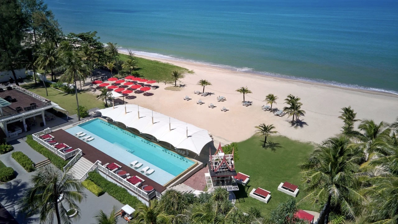 large swimming pool on the beach at xana beach club in phuket